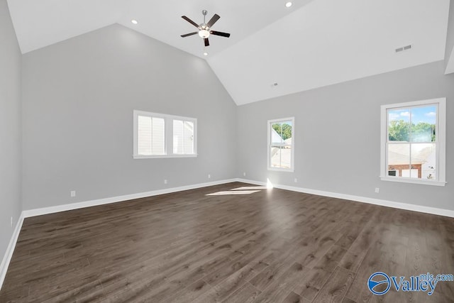 unfurnished room featuring dark hardwood / wood-style flooring, high vaulted ceiling, and ceiling fan