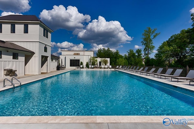 view of swimming pool featuring a patio area