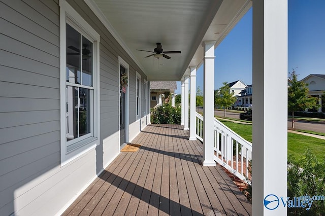 wooden deck with ceiling fan and a porch