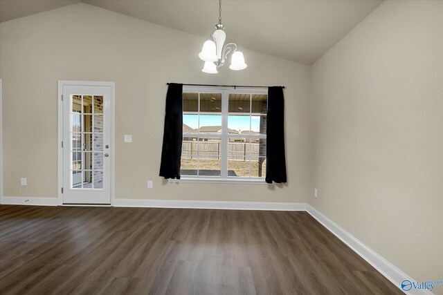 hallway with lofted ceiling and hardwood / wood-style floors