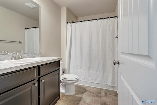 full bathroom with shower / bath combo, tile patterned flooring, vanity, and toilet