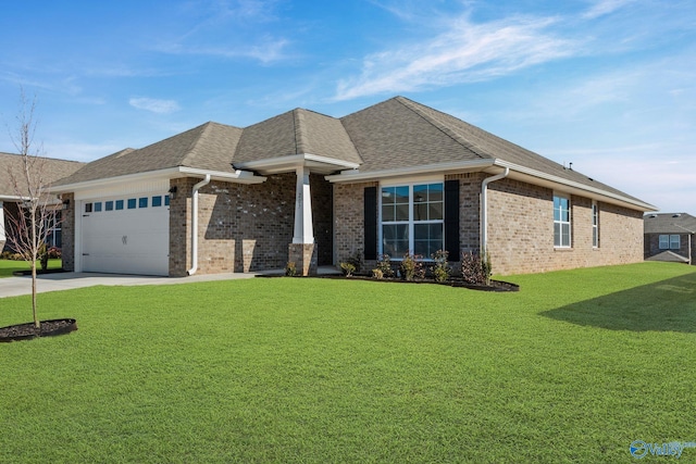 view of front of home featuring a shingled roof, a front lawn, brick siding, and an attached garage