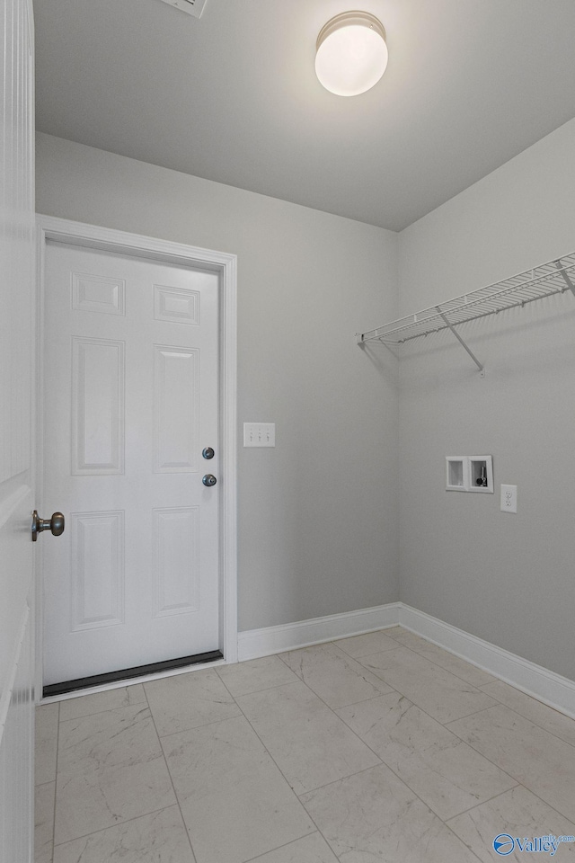 laundry area featuring hookup for a washing machine, marble finish floor, baseboards, and laundry area