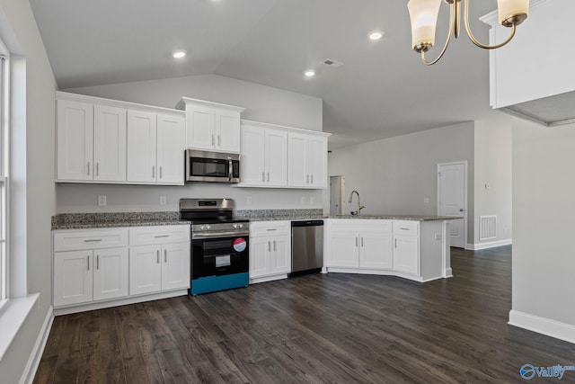 kitchen featuring white cabinetry, visible vents, appliances with stainless steel finishes, and dark wood-type flooring