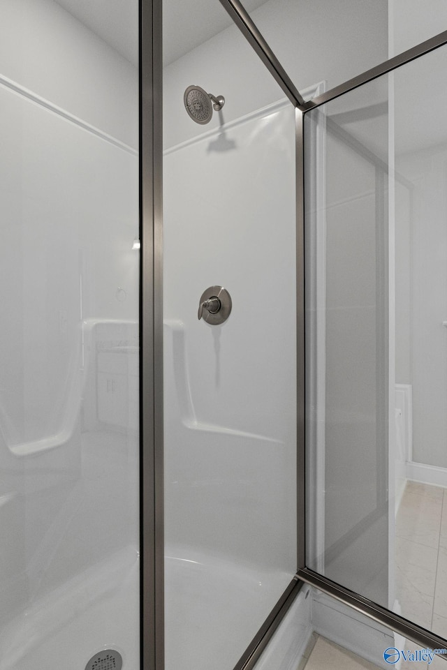 full bath with a shower stall