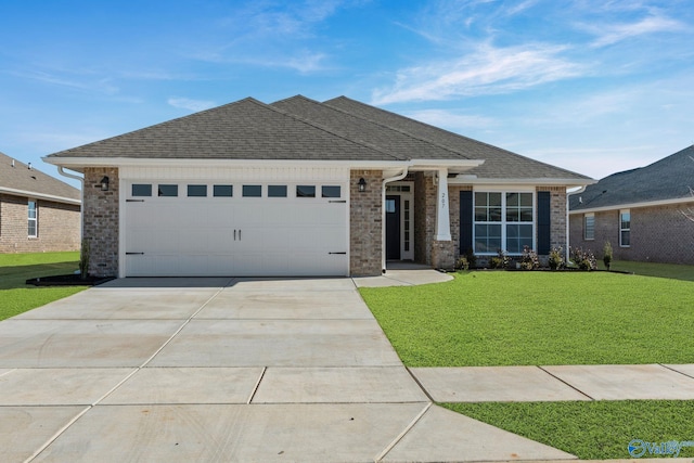 view of front of property featuring an attached garage, brick siding, concrete driveway, roof with shingles, and a front yard