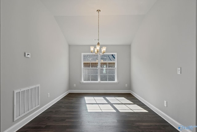 unfurnished dining area with a chandelier, visible vents, baseboards, vaulted ceiling, and dark wood finished floors