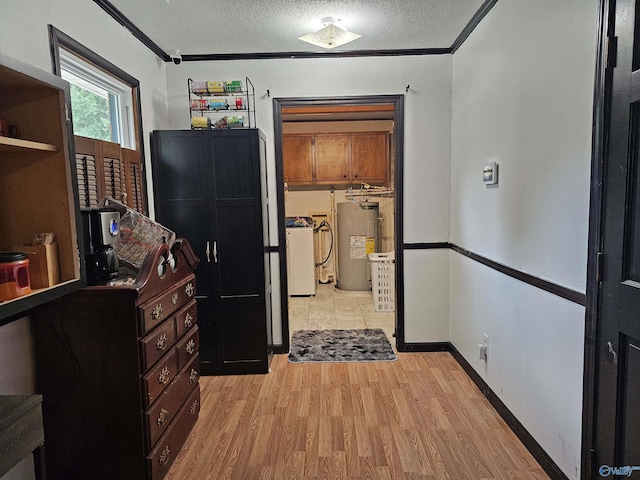 kitchen with crown molding, light hardwood / wood-style floors, water heater, and a textured ceiling