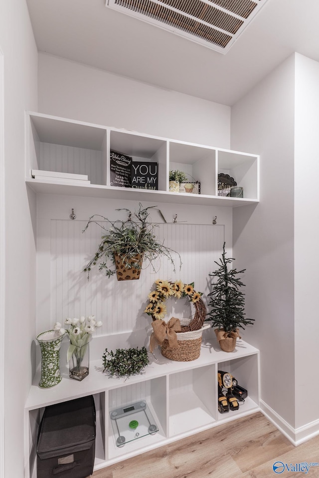 mudroom with light hardwood / wood-style floors