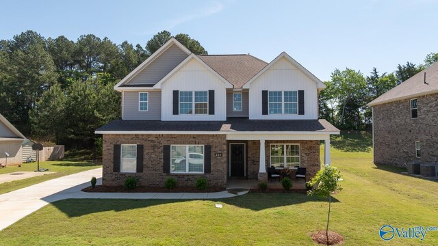 123 Ivy Vine Dr, Toney, AL 35773 - craftsman inspired home with a porch, brick siding, a front yard, and roof with shingles