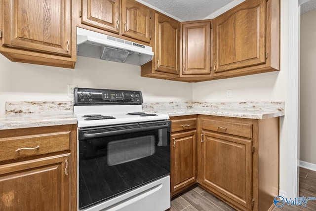 113 Suffolk Dr, Madison, AL 35757 - kitchen featuring white electric range, under cabinet range hood, light countertops, brown cabinets, and a textured ceiling