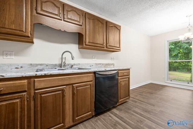 113 Suffolk Dr, Madison, AL 35757 - kitchen with dishwasher, a sink, dark wood-type flooring, a chandelier, and brown cabinets