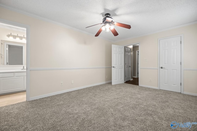 113 Suffolk Dr, Madison, AL 35757 - unfurnished bedroom with light carpet, crown molding, ensuite bathroom, baseboards, and a textured ceiling