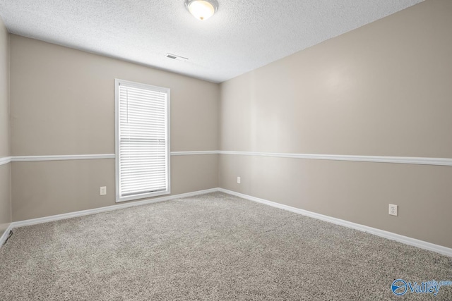 113 Suffolk Dr, Madison, AL 35757 - carpeted spare room with a textured ceiling and baseboards