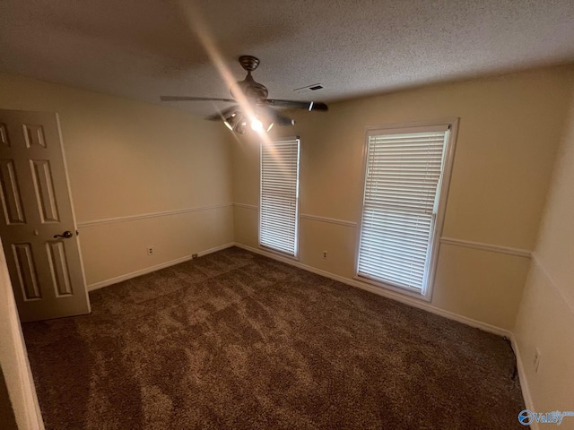 113 Suffolk Dr, Madison, AL 35757 - empty room with dark colored carpet, a textured ceiling, baseboards, and ceiling fan