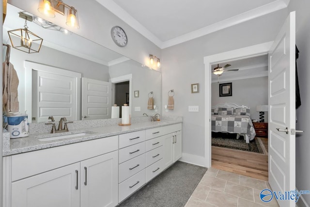 bathroom with ceiling fan, wood-type flooring, ornamental molding, and vanity