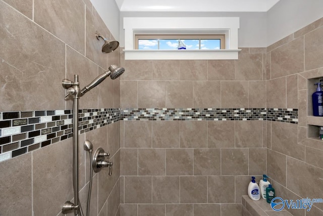 bathroom with tiled shower