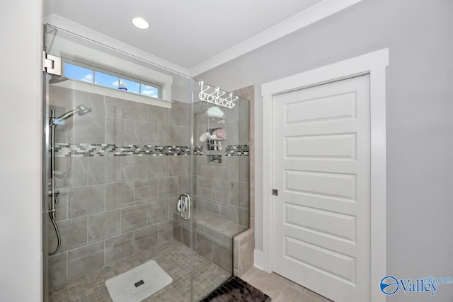 bathroom with tile patterned floors and an enclosed shower