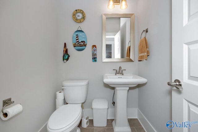 bathroom with tile patterned floors and toilet