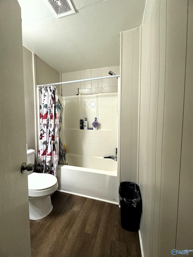 bathroom featuring toilet, shower / bath combo, and hardwood / wood-style floors