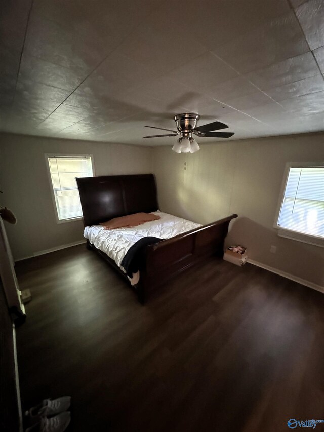 bedroom featuring ceiling fan and hardwood / wood-style flooring