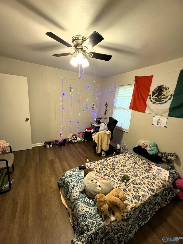 bedroom with ceiling fan and hardwood / wood-style floors