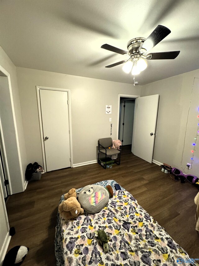 bedroom featuring hardwood / wood-style flooring and ceiling fan