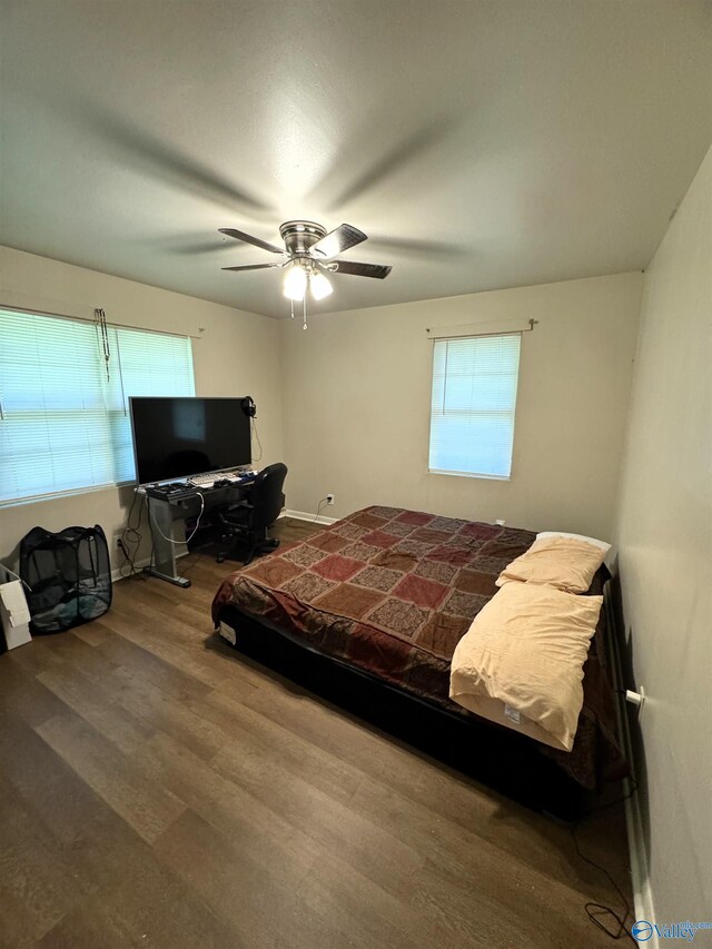 bedroom featuring ceiling fan and hardwood / wood-style flooring