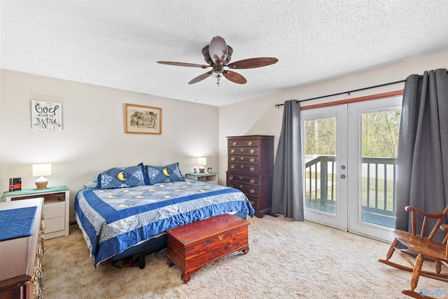carpeted bedroom featuring access to exterior, french doors, a textured ceiling, and a ceiling fan