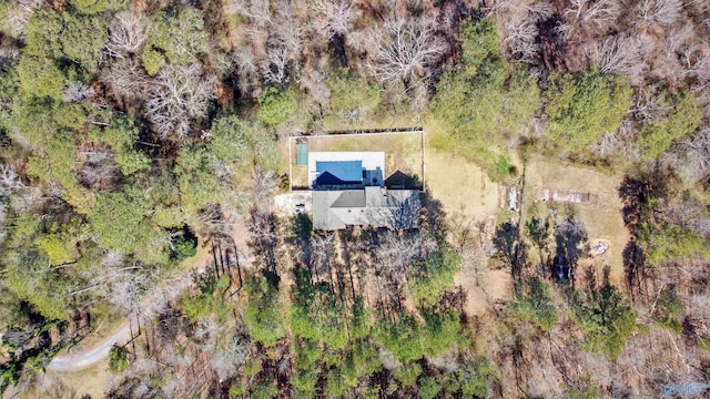 drone / aerial view featuring a view of trees