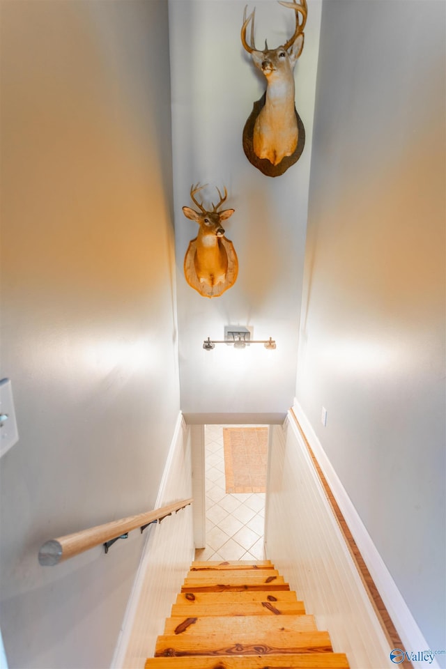 staircase with tile patterned flooring