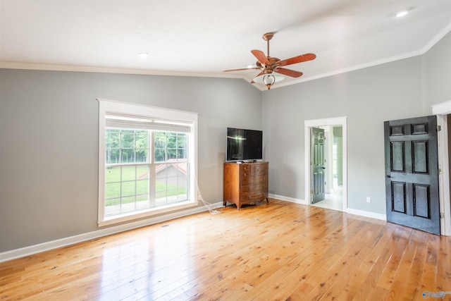 unfurnished living room featuring ornamental molding, lofted ceiling, ceiling fan, and light wood-type flooring