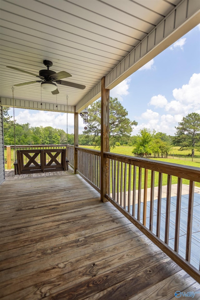 wooden terrace featuring ceiling fan