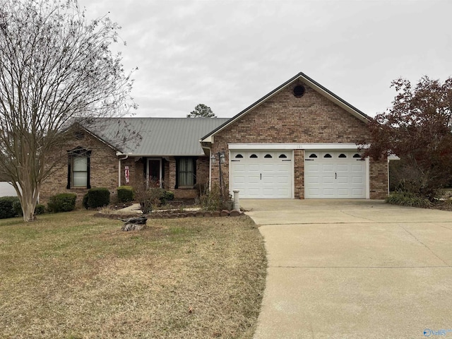 ranch-style house with a front yard and a garage