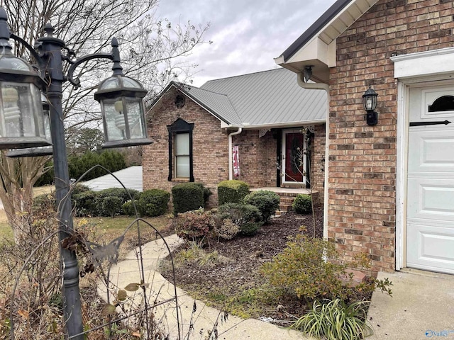 view of exterior entry featuring a garage