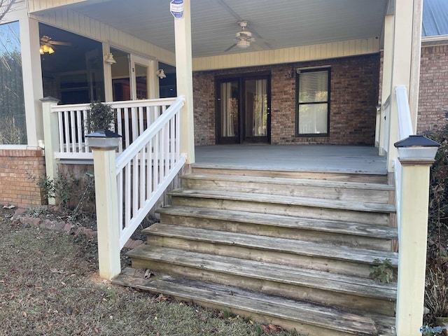 deck with covered porch and ceiling fan