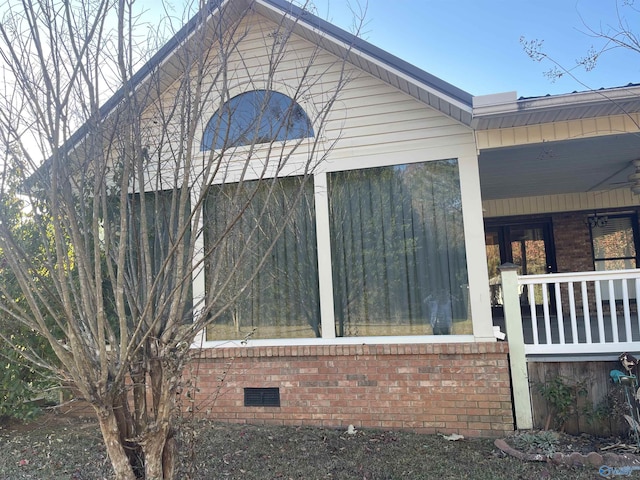 view of side of property featuring a porch