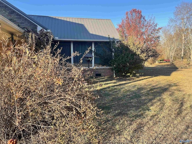 view of home's exterior featuring a lawn