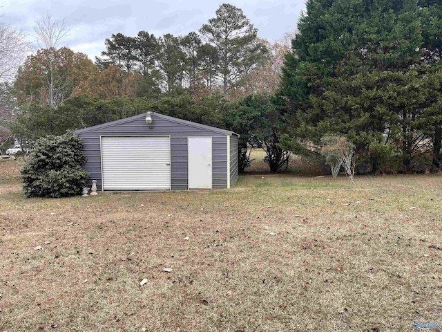 garage featuring a yard