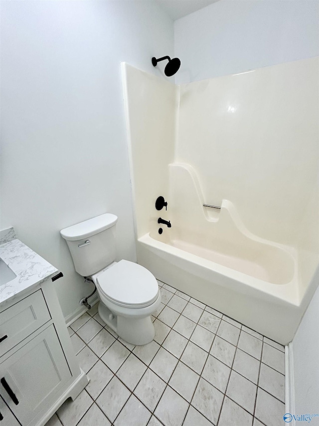 full bathroom featuring tile patterned flooring, bathtub / shower combination, vanity, and toilet