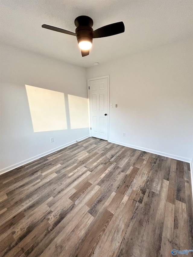 spare room featuring ceiling fan and hardwood / wood-style flooring