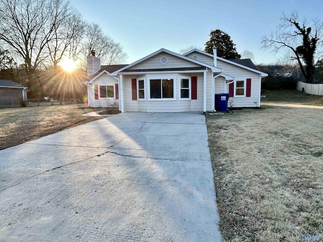 view of front of house with a yard