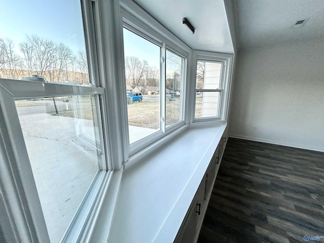 doorway with dark hardwood / wood-style floors