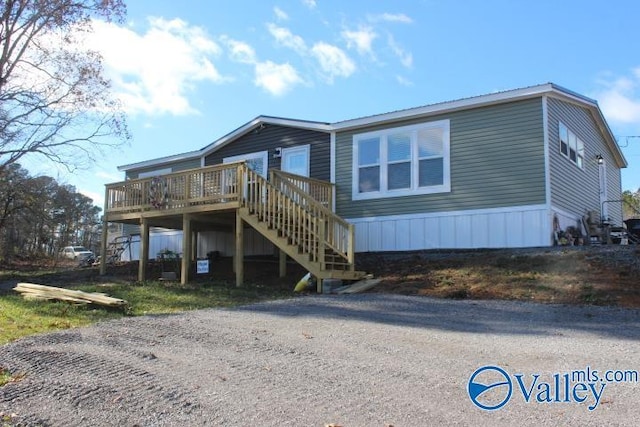 rear view of property with a deck