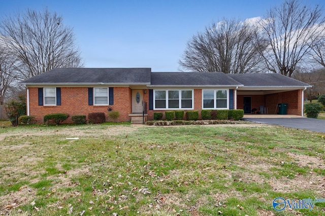 single story home with a carport and a front yard