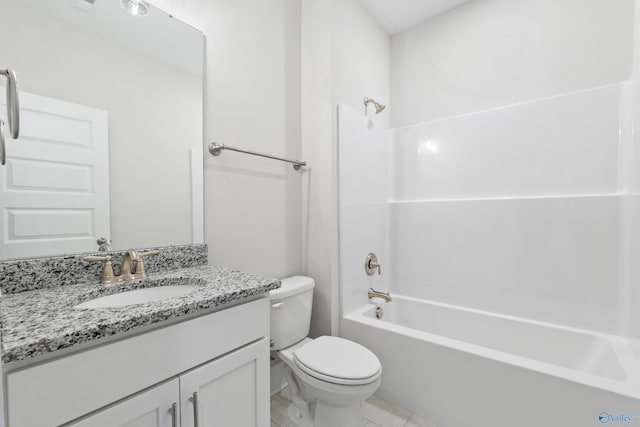 bathroom with toilet, tile patterned floors, bathing tub / shower combination, and vanity