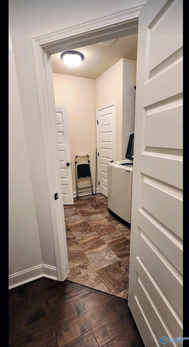 interior space featuring washer / clothes dryer and dark hardwood / wood-style flooring