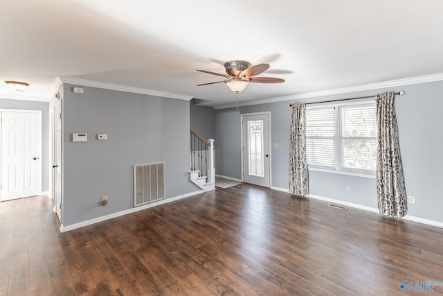 unfurnished room featuring ceiling fan, dark hardwood / wood-style floors, and ornamental molding