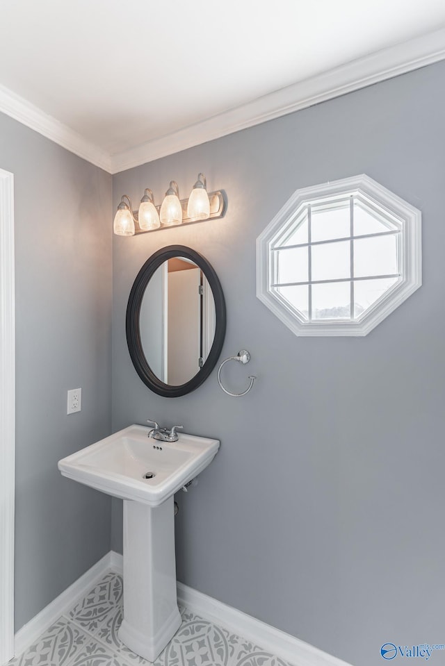 bathroom with tile patterned floors and ornamental molding