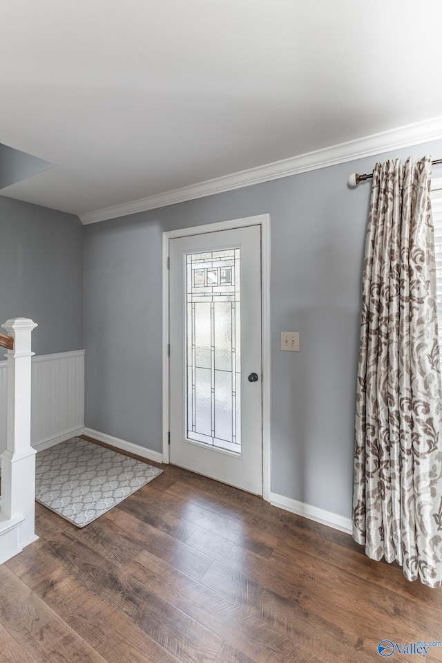 foyer with dark hardwood / wood-style flooring and crown molding